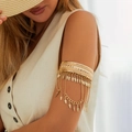Golden boho arm chain featuring geometric relief, leaf fringe, and metallic tassels - Gold Leaf Fringe Style (0310)