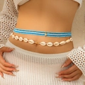 Detailed view of layered bohemian waist chains with natural shells and starfish charm - Waist Chain (415010K1) / Gold + Blue