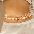 Detail view of multi-layered bohemian waist chain with shells and golden star pendant - Waist Chain (415010K4) / Gold + Pink