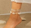 Detailopname van bohemian lichaamsketting met natuurlijke schelpen en zeester op strand - Veelkleurig 2