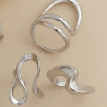 Macro shot of liquid lava irregular rings with high-polish silver finish three-piece set - Irregular Wave Set / Silver