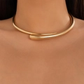 Minimalist geometric spring choker necklace in polished golden finish worn by a model - Gold (Choker)