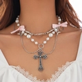 Close-up of layered punk necklace with silver cross, faux pearls and pink ribbon bow - Pink Bowknot Pearl Style / Silver White Pink (6504k3)