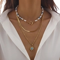 Close-up of three-layer layered necklace set with pearls, snake chain and sun pendant - Gold Style 01 (5304)