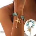 Bracciale stile oceano con pietre turchesi, ciondolo a stella marina dorata e perla bianca - Bracciale (2460) / Blu