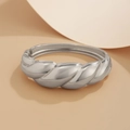 Polished silver croissant style twisted bangle bracelet with elegant metallic finish - Twisted Hinge Bangle (2429) / Silver