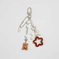 Cute brown bear keychain with strawberry tea charm and pearl bow accents on white background - Milk Tea Bear Style (02 Silver k 0275)
