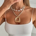 Layered gold necklace featuring baroque pearls and a hammered round pendant on a model - Gold Geometric Pendant Layered Necklace (6767)