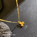 Golden bow leaf pendant necklace in brushed finish with adjustable cable chain - Three-Leaf Windmill