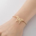 Elegante goudkleurige roestvrijstalen armband met een delicate holle vlinderhanger - Gouden Vlinder Parel