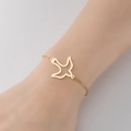 Pulsera minimalista de acero inoxidable dorado con colgante de pájaro hueco elegante - Pájaro 1 Dorado