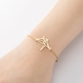 Pulsera minimalista de oro con grulla de origami en muñeca con elegante cadena de eslabones - Grulla Origami Dorado