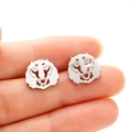 Macro shot of silver hollow-out tiger stud earrings with brushed stainless steel finish - Tiger / Lion Head (687) / Steel