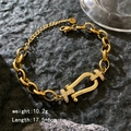 Elegant gold horseshoe clasp chain bracelet with shimmering white zircon stones - Oval Horseshoe Buckle / Gold - Oval Horseshoe