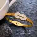 Golden Mobius spring bracelet with zircon infinity symbol and intricate hollow pattern - Full Zirconia Mobius Bangle / Gold