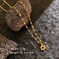 Macro detail of gold hexagram pendant necklace with dimensions on volcanic rock - Hexagram Necklace