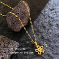 Golden necklace with hollow heart petal flower pendant on textured volcanic rock surface - Five-Petal Flower Necklace