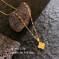 Golden rose clover necklace with radial texture on volcanic stone display, 2.7g weight - Laser Clover Necklace