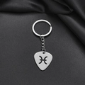 Macro detail of silver stainless steel keychain featuring a hollow Pisces zodiac charm - 012