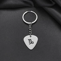 Detailed macro of silver stainless steel keychain with hollowed-out Capricorn zodiac sign - Capricorn (010)