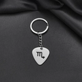 Detailed macro of a polished Scorpio zodiac sign on a stainless steel keychain - Scorpio (008)