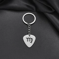 Macro shot of silver stainless steel guitar pick keychain with Virgo zodiac engraving - Virgo (006)