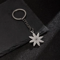 Minimalist silver flower petal keychain with star engraving on stone background - Star Pattern Flower Style (201)