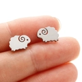 Minimalist stainless steel sheep stud earrings with matte finish shown on finger - Sheep (372) / Steel