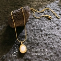Elegant gold snake chain necklace with white oval moonstone pendant for women - Gold