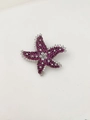 Detail of starfish brooch with pink and white rhinestones on silver-toned metal - Rose Red
