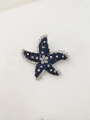 Close-up of luxury starfish brooch with dark blue and clear rhinestones on white base - Dark Blue