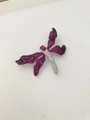 Macro shot of dragonfly brooch with pink wing stones and white crystals on silver base - Pink Purple Style (03)