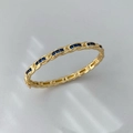 Gold plated woven bangle featuring square cut blue cubic zirconia stones - Gold Blue Zircon