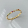 Elegant gold twisted band ring featuring a rainbow of multicolored micro-set zircon stones - Gold Color Multicolored Zirconia