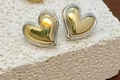 Detail of heart-shaped stud earrings in two-tone gold and silver on white stone - Two-tone Wrapped Edge Heart Style (Double Color 6)