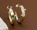 Detail of gold hoop earrings with silver star studs on brown background with white stone - Star Embellished Hoop Style (Double Color 4)