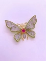 Macro view showing detailed cubic zirconia micro-inlay on gold butterfly brooch - Gold Green Zirconia