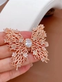 Detailed view of large green butterfly brooch with zircon inlays and rose gold plating - Rose Gold