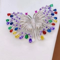 Micro-pave butterfly brooch featuring colorful gemstones and a polished silver base - Colorful White