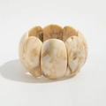 Macro view of wide stretch bracelet showing tortoiseshell resin textures and curved segments - Resin Slices (2958) / Off White