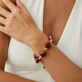 Irregular burgundy resin beaded bracelet with gold metal spacers on model wrist - Wine Red Gold Bracelet (2973)