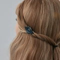 Detail of small black bat hair claw clip styled on wavy light brown hair for Halloween - 05 Black 0674