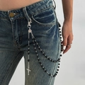Gothic multilayer waist chain with black beads, silver cross and coin on blue jeans - Silver & Black