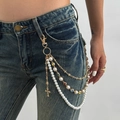 Y2K gold waist chain with white faux pearls and a rhinestone cross pendant detail - Gold Style (1966)