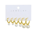 Detail of three pairs of gold-plated hoop earrings with graduated white pearls on a card - Artificial Pearl Graduated Hoop Style (2E10M24111)