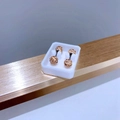 Macro shot of 5mm double-headed barbell earrings with champagne crystal pavé inlay - 5mm Champagne Zirconia