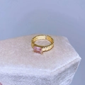Elegant gold open ring with rectangular pink stone on a velvet jewelry display - Stepped Texture Pink Zirconia Style (D50 Pink Zirconia)
