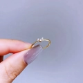 Detail view of thin gold minimalist ring featuring three micro-set zircon stones - Gold Heart with Three Zircons