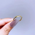 Detail of adjustable gold bamboo ring featuring colorful enamel accents and polished finish - Gold Bamboo Style with Enamel
