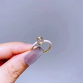 Macro shot of gold ring with pink enamel detail and rectangular zircon featuring H-shaped base - Gold Light Pink H-Shape Zircon Style